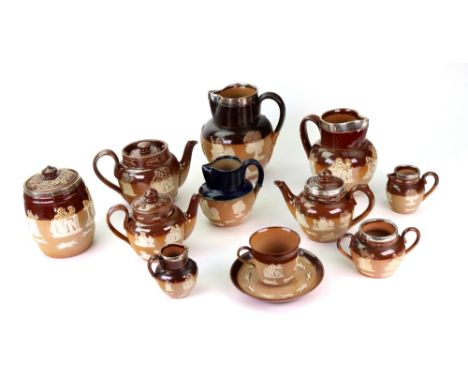 A group of Doulton brown stonewares, late 19th/early 20th century, sprigged with topers, windmills, trees and hunting scenes,