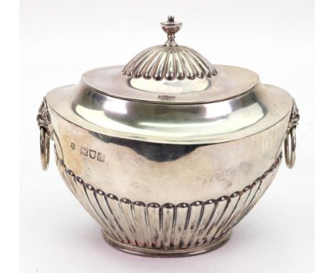 A Regency style oval silver tea caddy, Gibson & Langman for Goldsmiths & Silversmiths Company, London 1899, part lobed and fl