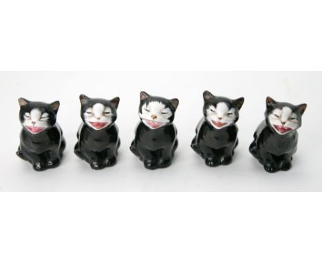 A group of five Royal Doulton figures of 'Lucky' the black cat, model K.12, 1932-75, green printed marks, 7cm high (5).