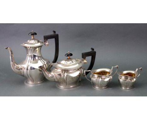 An Edwardian silver four-piece tea and coffee service, A & J Zimmerman, Birmingham 1908 and 1909, oval with bulbous lobed and