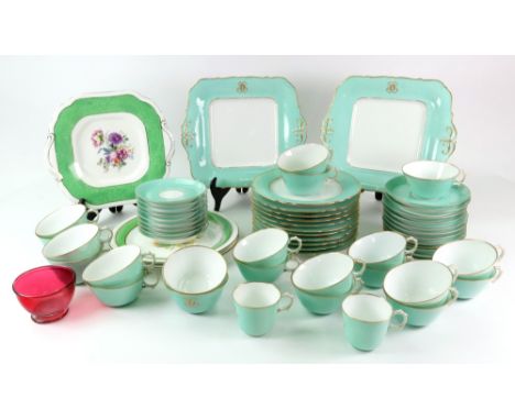 A Richard Briggs Boston French porcelain tea and coffee service, late 19th century, pale green ground, initialled 'D' amongst