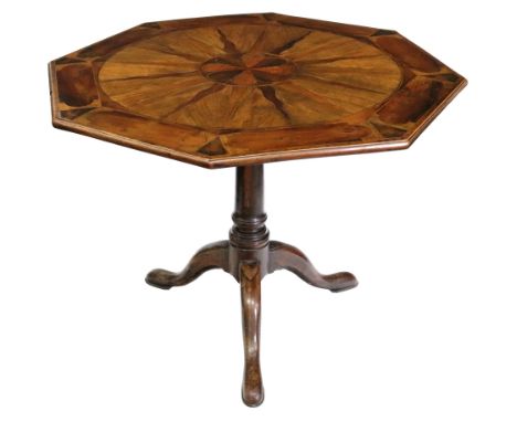 A George III walnut and yew wood centre table, the gun barrel turned pillar, on a tripod base headed by lappets, on pad feet,