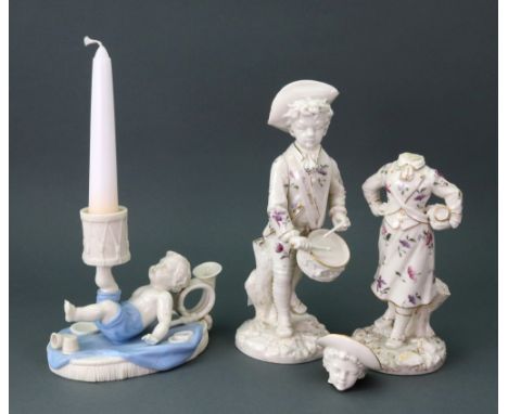 A Royal Worcester boy and drum taperstick, circa 1870, the child lying on his back wearing blue shorts, balancing a drum on h
