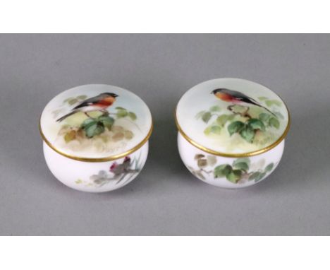 A pair of Royal Worcester small circular pots and covers, circa 1934, each painted by Powell, signed, with a bird in branches