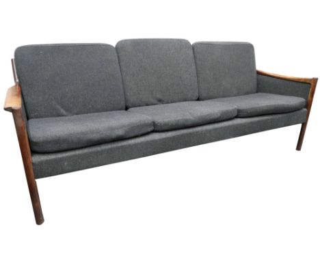 A 1960s Scandinavian designed rosewood frame three seat sofa, upholstered in grey with loose back and seat cushions 196cm wid