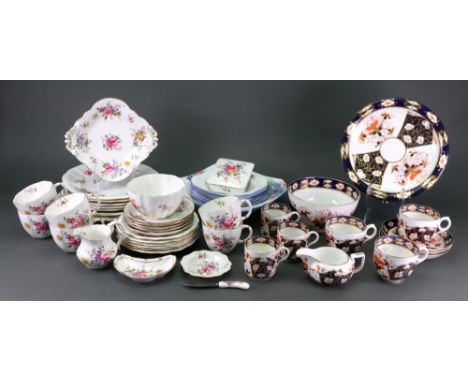 A Royal Crown Derby vine pattern plate, 26.5cm diameter, a similar Royal Crown Derby tea service, twenty eight pieces, a Shel