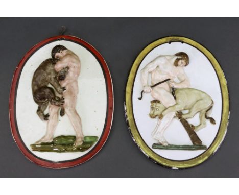 An oval earthenware plaque, dated 1823, moulded and coloured with Hercules capturing the Cerberus, incised 'M B 1823', pierce