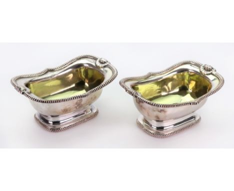 A pair of George III silver salt cellars, John Yonge & Sons, Sheffield 1808, curved oblong, with shaped gadroon borders inter