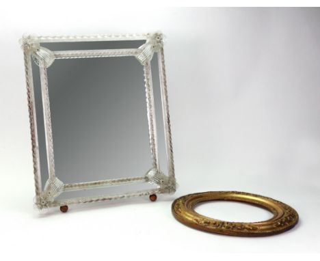 A Venetian marginal dressing table mirror, 20th century, with spiral borders and flowerhead and leaf applied corners, mahogan