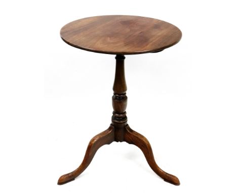 A George III style mahogany pedestal table, the circular tilt-top, on a vase turned pillar and tripod base with pointed pad f