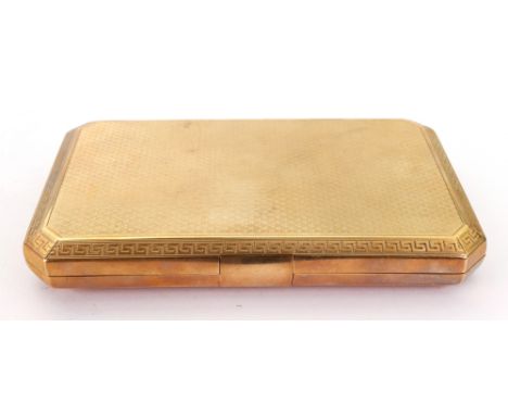 A 9ct gold rectangular engine turned cigarette case, Deakin & Francis, Birmingham 1923, with Greek key borders, canted corner