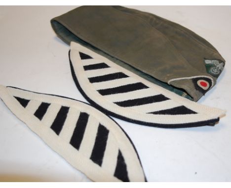 A modern German army side cap; together with Guards Musician shoulder wings 
