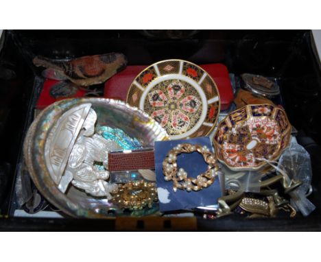 A tin trunk and contents to include; Crown Derby pin dish in the 2451 pattern, Crown Derby saucer in the 1128 pattern, commem