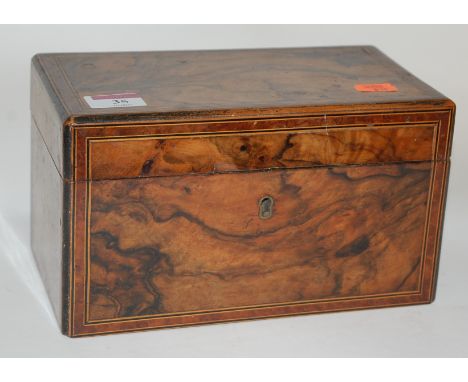 A late George III figured walnut, box wood and ebony strung tea caddy of rectangular form (lacking interior) containing vario