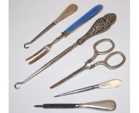 Assorted silver handled sewing tools to include; button hooks, file, scissors etc 