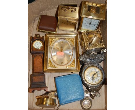 A modern lacquered brass carriage clock having enamel dial and Roman numerals with visible platform lever escapement together