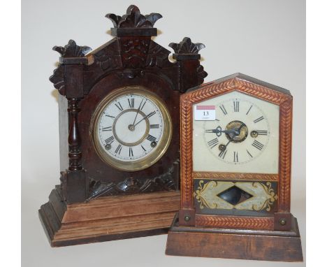 A late 19th century German stained pine cased mantel clock having an enamel dial with Roman numerals together with one other 