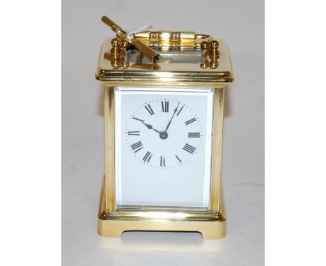 A French lacquered brass carriage clock having visible platform escapement, single barrel going 8-day movement with key