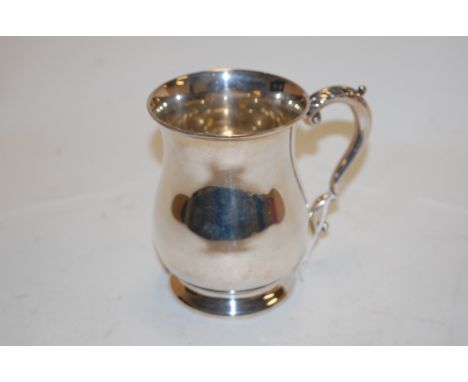 A modern silver bell shaped tankard in the Georgian style of plain undecorated form with C-scroll handle, Barker Ellis Silver