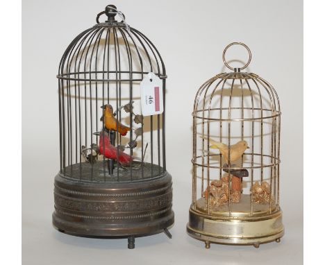 A reproduction clockwork bird in cage automaton, together with one other similar (2)   Condition Report / Extra Information  