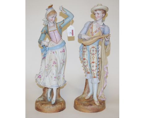 An early 20th century bisque porcelain figure of a man playing a lute together with a female companion (a/f), height 47cm