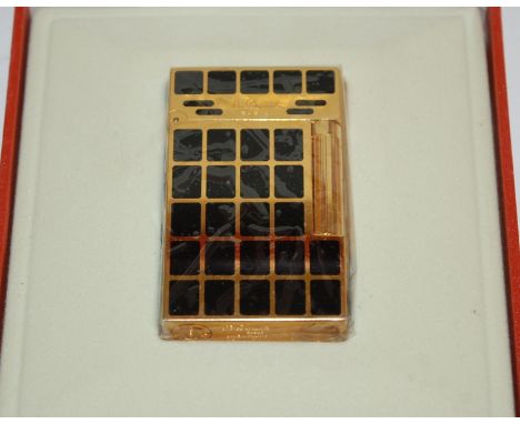 A Du Pont of Paris pocket cigarette lighter, in original leather box, with outer box and sleeve