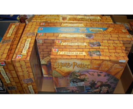 Two boxes of assorted Harry Potter toys and games to include; 300 piece jigsaw puzzle, Chamber of Secrets trivia game, Harry 