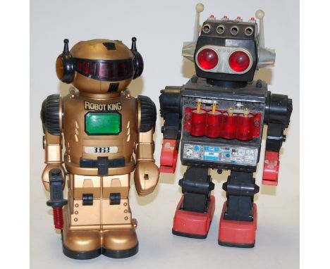 A boxed Chinese battery operated space walkman figure; together with three other battery operated robot figures (4)