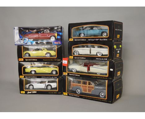 Eight boxed Maisto diecast model cars in 1:18 scale including Cadillac Eldorado Biarritz, a 1956 Chrysler 300B and a Special 