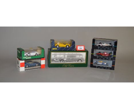 A mixed group of boxed Continental diecast models in 1:43 scale, including an Old Cars Ferrari Racing Car Transporter, a 'Sta