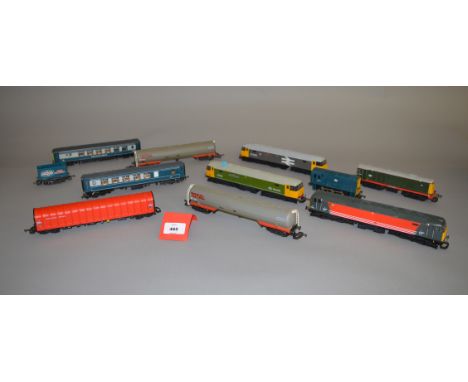 OO gauge. Five unboxed Lima diesel locomotives, with five items of rolling stock. Overall appear G.