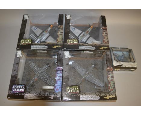 Four Unimax Forces of Valor 1:32 scale diecast model aircraft, together with another in 1:72 scale. E and boxed, some boxes r