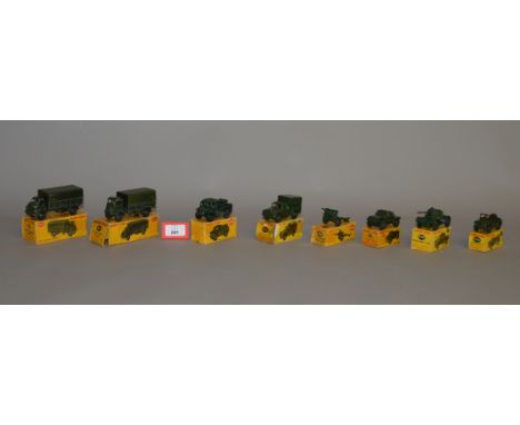 Eight boxed Dinky Toys military diecast models, including 621 3 Ton Army Wagon, 641 1 ton Cargo Truck and 688 Field Artillery