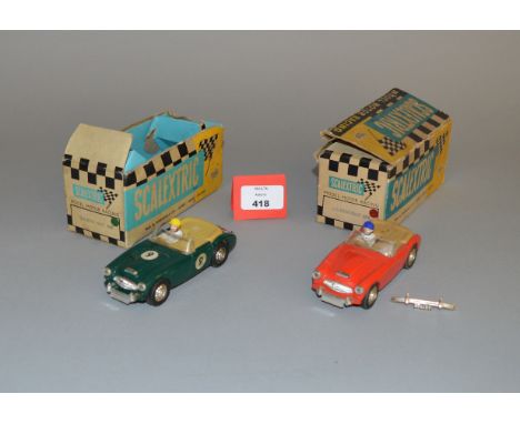 Scalextric 1960's C74 Austin Healeys x 2 Both appear P-F (red car has no motor) in Poor boxes.
