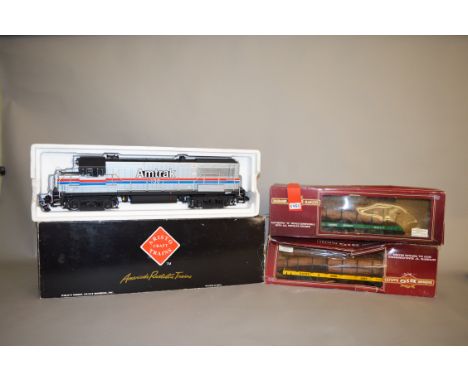 Gauge 1. A boxed Aristo-craft Trains #22136 Amtrak GE U25-B Diesel Locomotive together with two boxed 'Bachmann Big Hauler' G