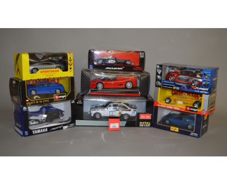 Nine diecast models, all 1:18 and 1:24 scale, by Bburago, Maisto and others, including Sun Star Ford Escort MkII. Overall app