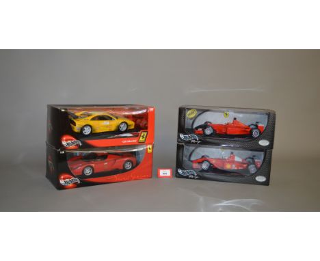 Four boxed Hot Wheels diecast models in 1:18 scale, a #56293  Enzo Ferrari, and an F355 Challenge together with two F2001 #50