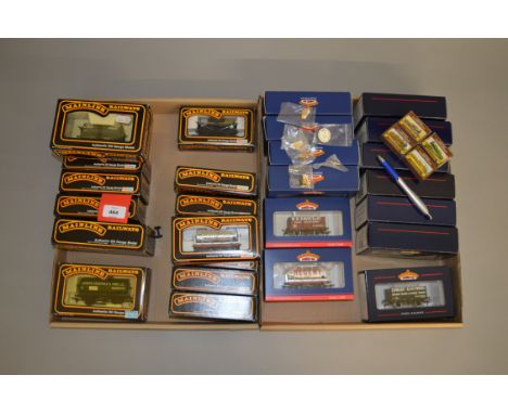 OO gauge. 29 x boxed rolling stock: 13 x Bachmann; two Hornby; 14 x Mainline. Together with a selection of collector's pin ba