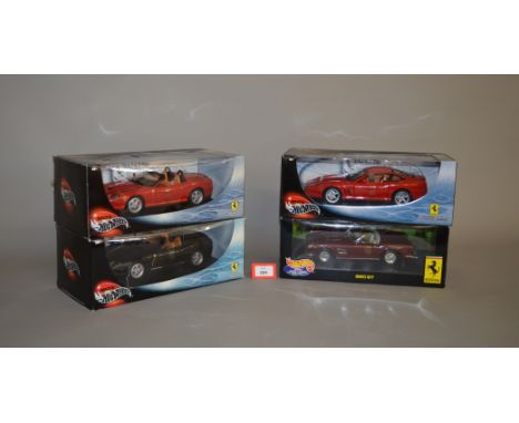 Four boxed Hot Wheels diecast models in 1:18 scale, a 250GT, two different 550 Barchetta Pininfarina models and a 575MM. Mode