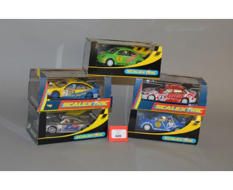 Five Scalextric cars: C2336 VW Beetle; C2337 VW Beetle; C2084 Vauxhall Vectra; C2081 Mercedes GTI (unscrewed from base); C206