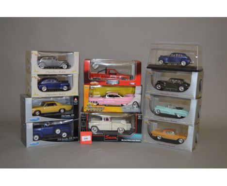 Eleven boxed diecast model cars, including  examples in 1:24 and 1:32 scales, by Signature Models, Saico, Welly and others. O