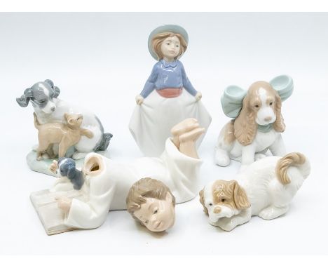 Five Nao figures of dogs and children with dogs