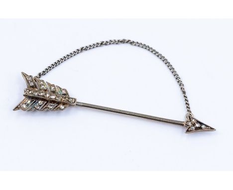 An Edwardian diamond set jabot pin in the form of an arrow, the fletching and arrow head set with small diamond chips, length
