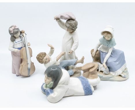 Four Nao figures of young children