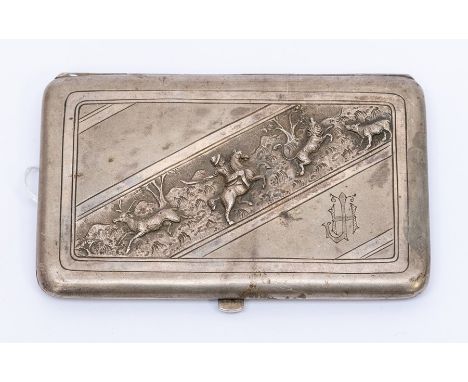 A late 19th Continental white metal cigarette case, the cover decorated with a cental diagonal panel chased and engraved with