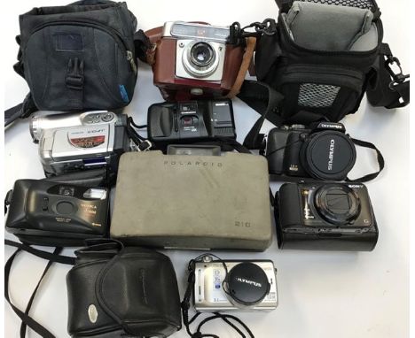 A collection of assorted cameras including an Olympus optical zoom with case, an Olympus digital camera, C760, ultra zoom, ca