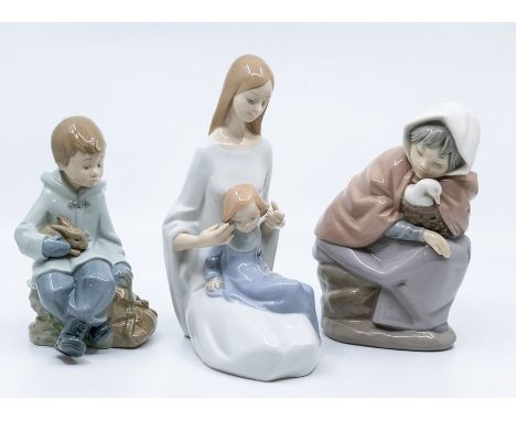 Three Nao figues with rabbit, child and duck