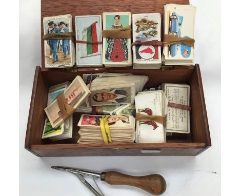 Small mahogany box with John Player and Sons collectors cards along with a rag doll and hunting fox