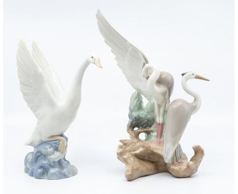Two Nao figures of birds, stalks and geese
