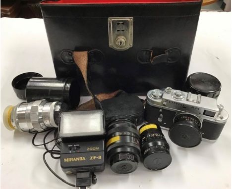 A collection of camera related items, including a 64R Super 8 Movie Camera, a Zorki 4K with various lenses, a flash light, a 